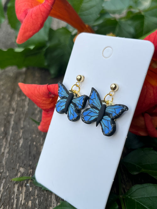 Blue and Black butterfly earrings on 24k gold filled postswith Gold tone coin back