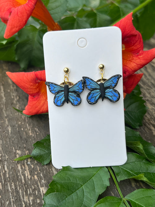Blue and Black butterfly earrings on 24k gold filled postswith Gold tone coin back